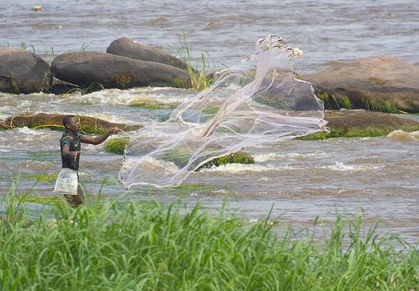Boy fishing in Congo